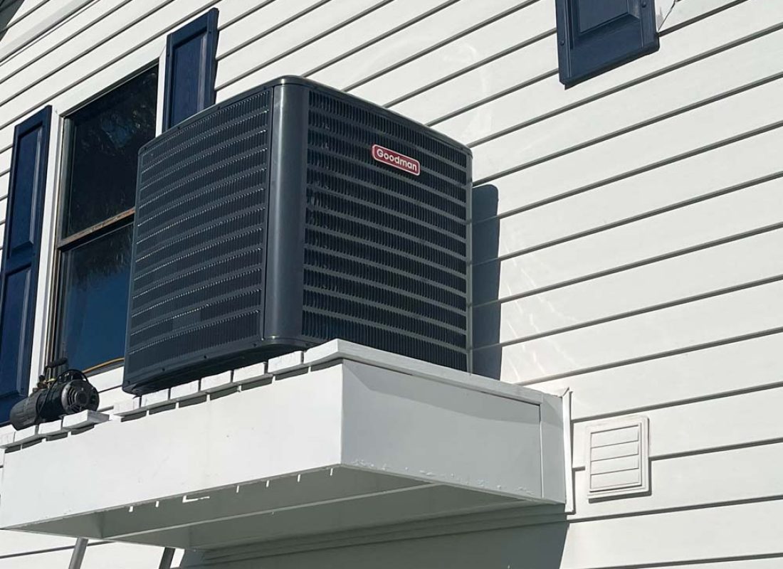 Experienced HVAC technician diagnosing AC performance issues with gauges and electrical testing tools